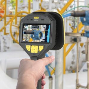 A handheld instrument used to inspect machinery. The display on the device shows an enlarged view of a valve or pipe section with buttons below the screen to control the device.